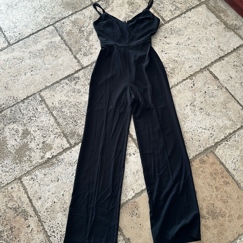 BEBE Romper. Dressy/classy. Black. Size 8